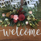 Welcome sign with flowers